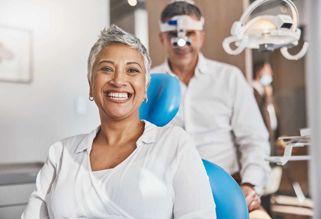 A smiling patient with a dental professional